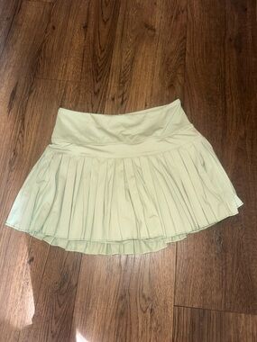 Gold hinge green tennis skirt
